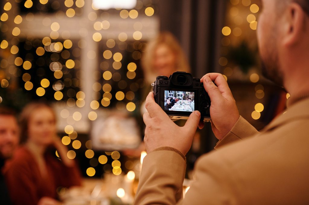 Choosing a camera, photographer taking family photos.