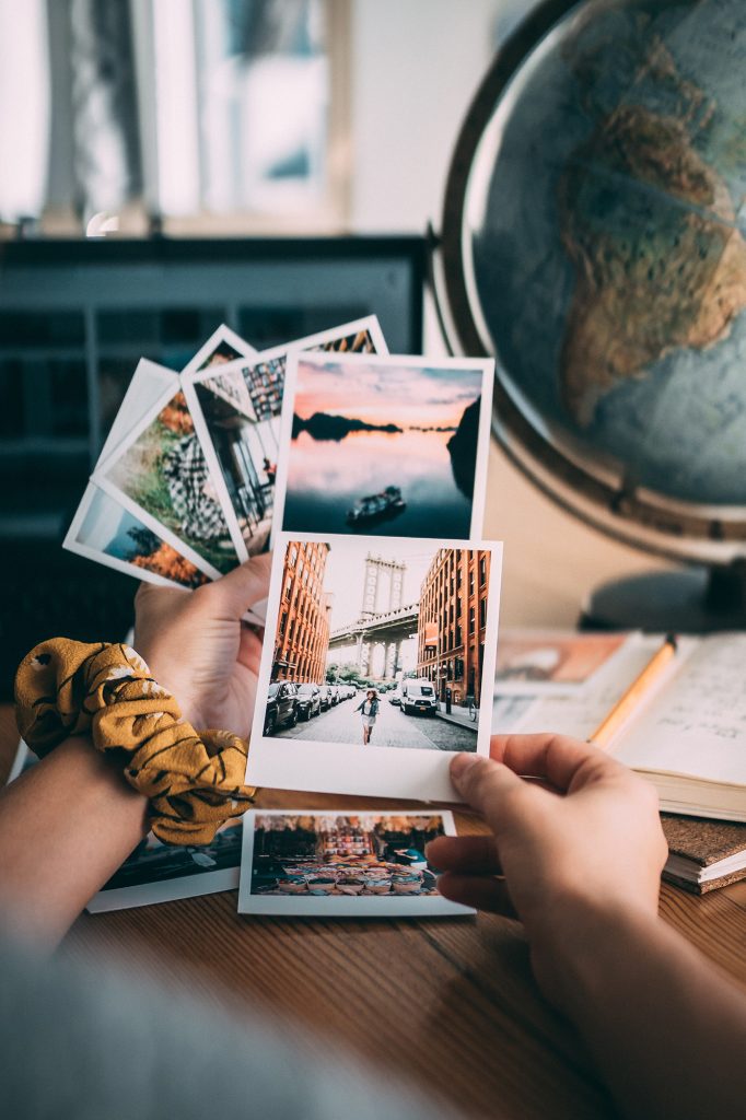 Travel photography, photography with prints from vacation and globe. 